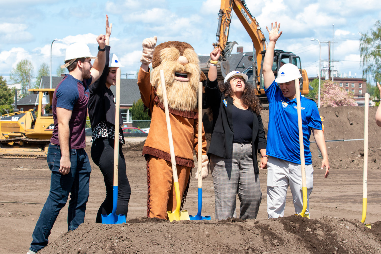 From left to right, Student Body Publicity Coordinator Kollin Jurkey, Student Engagement Coordinator Madison Tibbetts, Blazer Bill, Student Body President Marisol Vargas and Student Body Vice President Ayden Ruminski, cheer during the groundbreaking ceremony for the new Centralia College athletic field Wednesday afternoon.